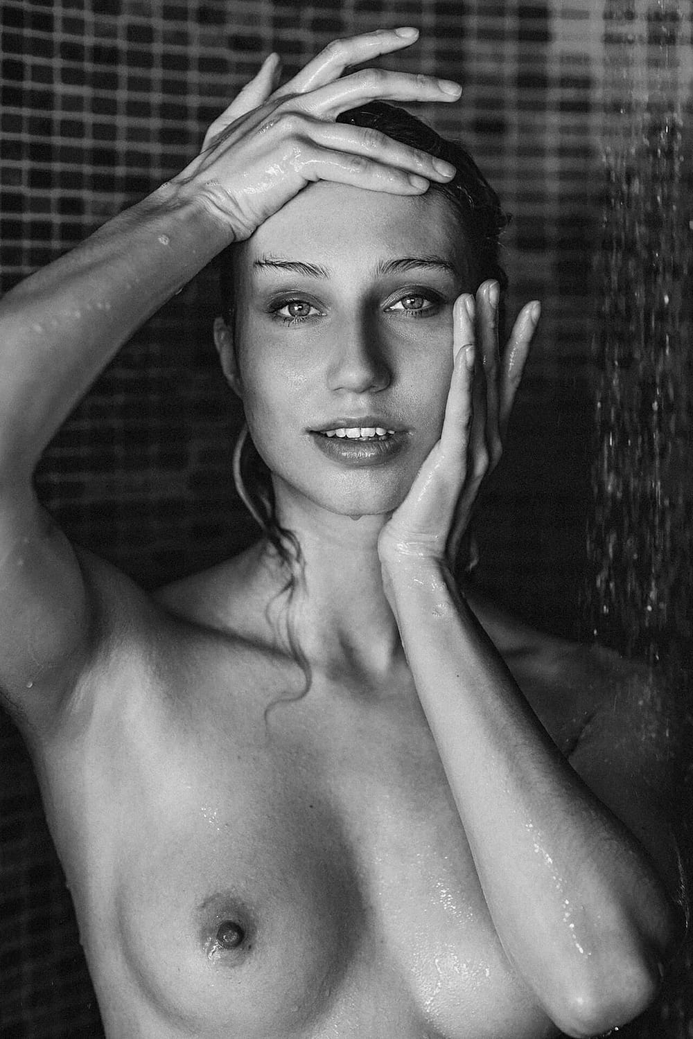 photography bw model posing in a shower with photographer in ibiza