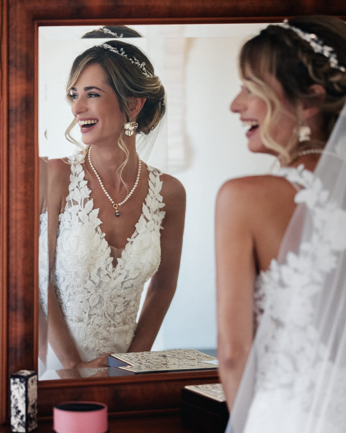 image of smiling bride from the mirror