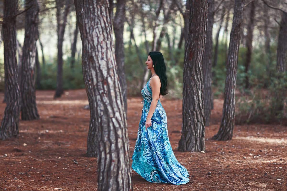 image of girl walking in forest by photographer in ibiza