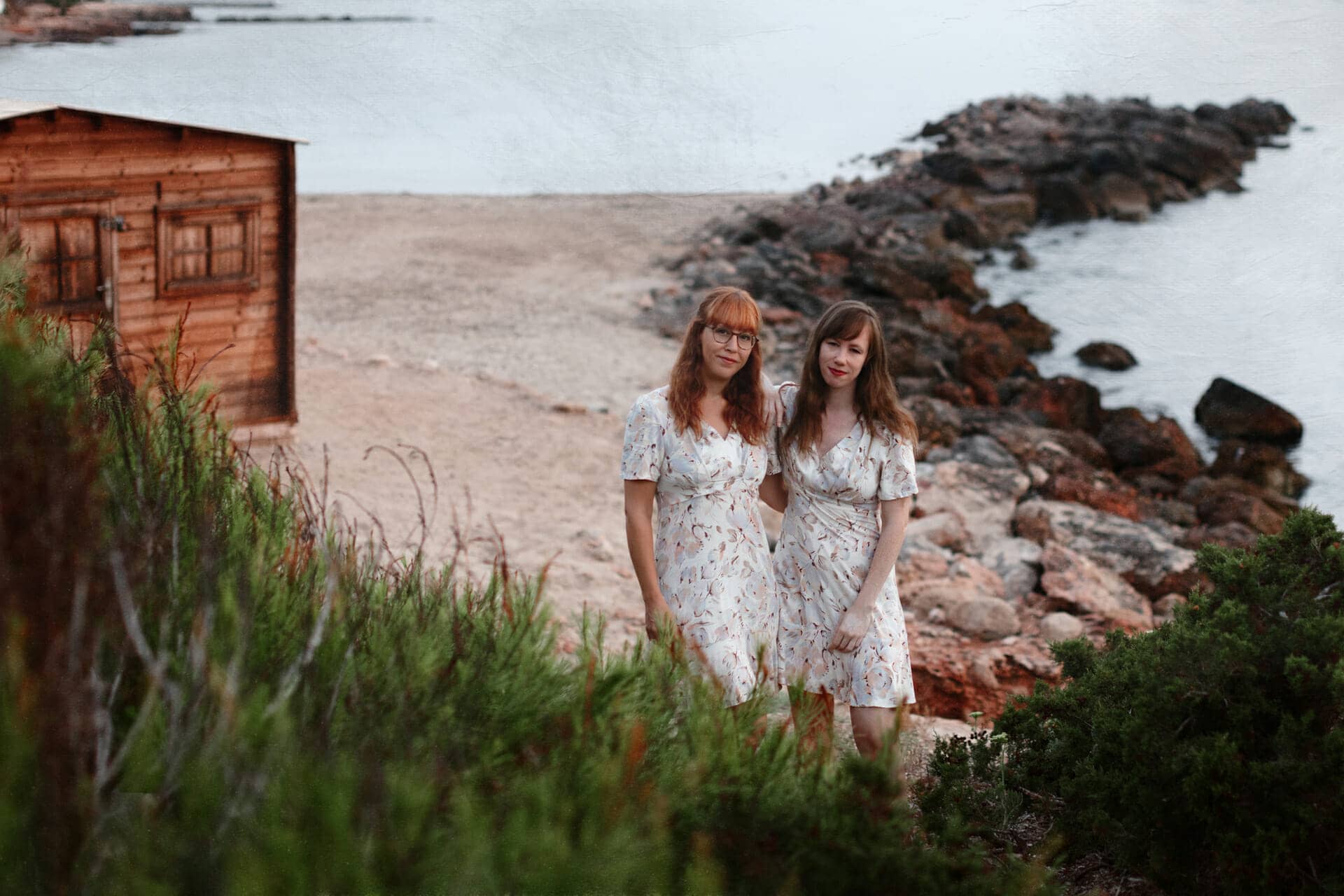 image of two sisters posing for photographer in ibiza